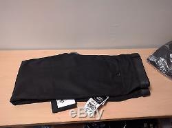 29 pairs of black trousers of varying sizes from 30S to 36L for work job lot